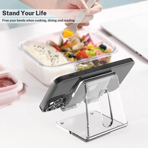 Crystal Clear Acrylic Phone Stand For Desk holding phone, beside salad bowl, showing portable use for hands-free viewing.