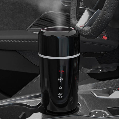 Road Warrior 420ml Portable Water Heater And 12V 24V Travel Kettle on car console, displaying temperature, designed for on-the-go hot water.