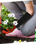 Snag This Badass Pair Of Cut Resistant Arm Sleeves And Heat Guards Designed For Gardening, showing black sleeves while planting flowers.