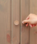 Person using Top Shelf Unfinished Wood Drawer Pulls Ten Pack Round Mushroom Cabinet Knobs on wooden cupboard.