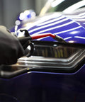 Pro Air Pressure Blow Gun With Beast Mode Jet Nozzle 230 Max PSI used on car headlight for detailing, rubber tip visible