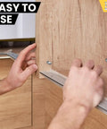 Hands installing Heavy Duty 100 Pack Stainless Steel Shelf Pins With Polished Nickel Finish in cabinet for home renovation.