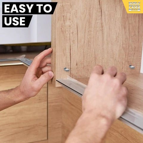 Hands installing Heavy Duty 100 Pack Stainless Steel Shelf Pins With Polished Nickel Finish in cabinet for home renovation.