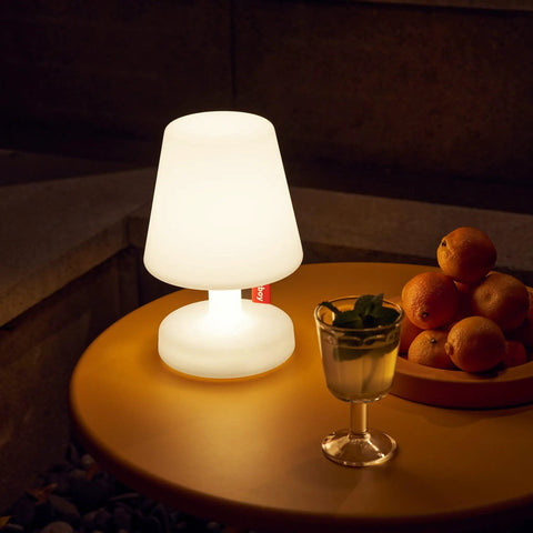 Tiny Rechargeable LED Lamp 2.0 Go Anywhere Dimmable Table Light for Indoor and Outdoor Use on patio table with fruit bowl