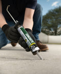 Person applying Concrete And Mortar Filler And Sealant In Gray For Interior And Exterior Cracks And Holes DIY Friendly