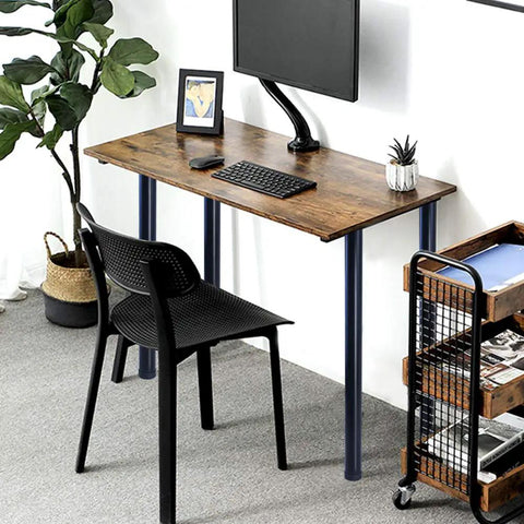 Adjustable 28 Inch Metal Desk Legs Set Of 4 In Heavy Duty Black Finish For Office Desks And Tables One Point Five Inch Diameter Height Adjusts About Point Seven Inch Includes Mounting Plates And Screws For Easy DIY Furniture Upgrade supporting a wooden desk