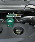 USUNRISE 8oz green metal oil can with flexible and straight spout resting on car engine bay.