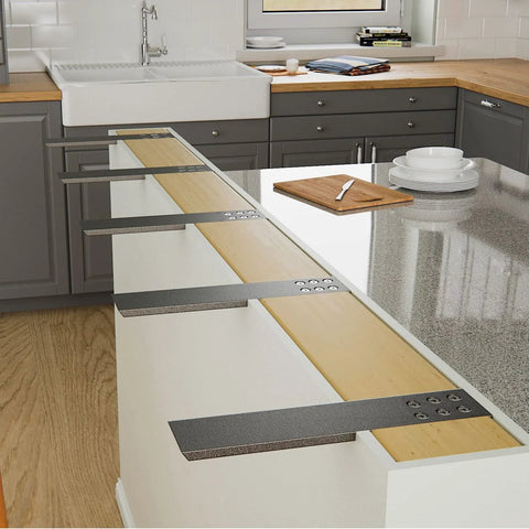 Four black steel countertop support brackets, 12 in long by 2.5 in wide (3/8 in thick), installed under a kitchen island counter