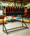 Heavy-Duty Life Jacket Drying And Storage Rack With Lockable Casters holding orange vests at a marina, durable wrought iron frame