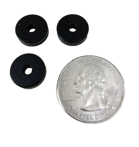 Three Sorbothane Vibration Isolation Washers 50 Durometer Black Rubber Bushings beside a quarter for size reference.
