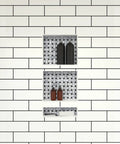 Triple Niche Recessed Shower Shelf With Three Built In Shelves Install Horizontal Or Vertical To Maximize Space Ideal For Soap Shampoo Razors And More Ready To Tile Surface For Custom Look 16 Inch Wide By 34 Inch High By 4 Inch Deep installed in a white tiled shower wall with bottles inside.