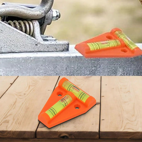 Orange T Shaped 2 Way Bubble Level For Caravan For Motorhome For Camper on a wooden surface and metal platform.