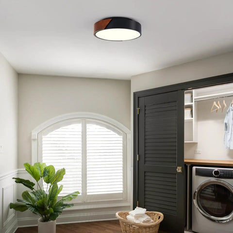 Sleek Modern Black Flush Mount Ceiling Light With 2 Lights, Mid Century Round Wood Accent Fixture in a laundry room.