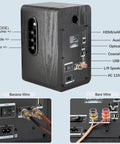 Back view of Powered Bookshelf Speakers with Wireless 100W RMS Bluetooth And eARC, showing various input connections and controls.