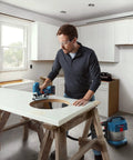 Man using Real Deal 18V Cordless Jigsaw Packing Brushless Muscle And Quick Swap Blades to cut a hole in a countertop.