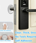 Clear Self Adhesive Door Stoppers For Wall Heavy Duty Gel Bumpers on a door handle, demonstrating easy installation and strong grip.