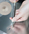 Using Dual Head Hammerless Nail Setter And 3/16 In Center Punch With 3500 PSI Striking Force on metal surface