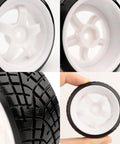 Close-up of 1/10 Scale RC Drift Tires With 12mm Hex Hub, slick design for on-road touring, showing tread detail and white rims.