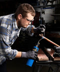 Person using Trigger Start Propane Torch For Home Projects With Webbed Flame, Easy Ignition, Versatile Soldering, Thawing, DIY tasks