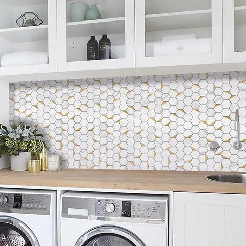 Peel And Stick Kitchen Backsplash Tiles Self Adhesive Hexagon Mosaic In White Marble With Gold Metal Accents Easy DIY Installation Durable PVC Composite 10 Sheet Pack For A Quick Slick High End Look installed in a laundry room.