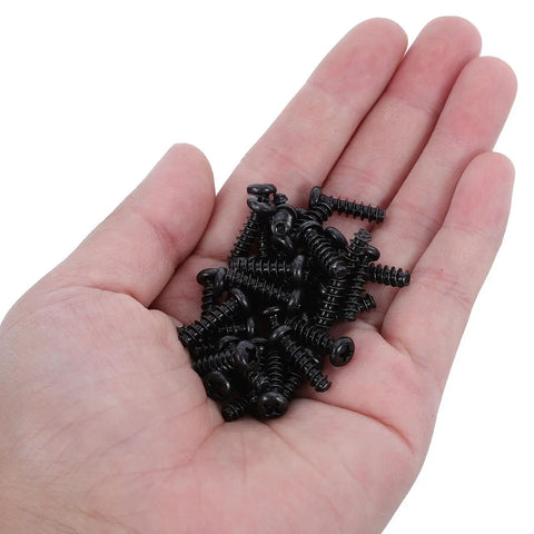 Grab These Happyyami M4x14mm Black Pan Head Self Tapping Screws With Cross Recess And Flat Point in a hand, showing pack for wood cabinet hardware.