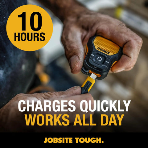 Wearable Clip On Bluetooth Speaker For Job Sites, being held, shows rugged yellow design and charging cable connection.