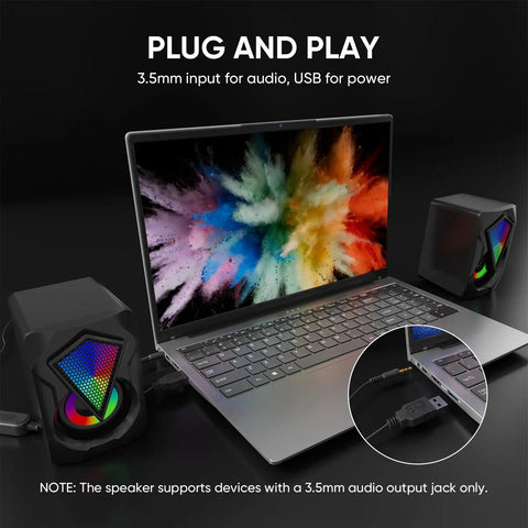 Desktop USB Powered 2.0 Computer Speakers With Volume Control And RGB LED Lights connected to laptop via 3.5mm aux input and USB power