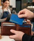 Slim RFID Blocking Card Sleeve Protectors For Credit Cards Debit Cards And ID Protection USA Made Leather Look Wallet Inserts Pack Of 16 Great For Everyday Security And Slim Carry Style With A Realistic Leather Look being used in a brown leather wallet