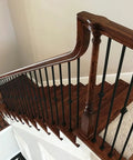 Staircase with wooden handrails and flat shoe for 1/2 inch square balusters, aluminum support, satin black finish, side set screw