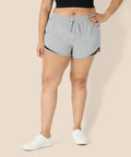 Model wearing Women's Regular Fit Athletic Woven Running Shorts With Ruched Waistband, Gray Heather, Size Medium, front view.