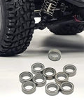 10 Piece Metal RC Car Bearing Kit With Sealed Ball Bearings For Trucks shown beside toy car tire