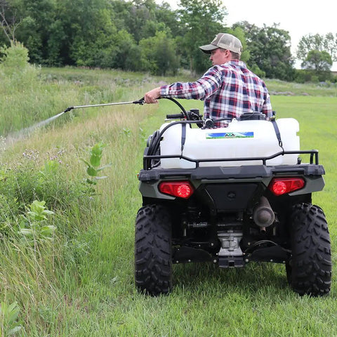 Person using 15 Gallon UTV And ATV Spot Sprayer With 1.0 GPM Pump, 40 PSI Max, Adjustable Spray Gun on grassy field