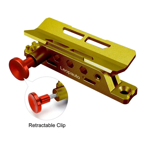 Close-up view of Universal Roll Bar Fire Extinguisher Mount Aluminum Quick Release Bracket With Eight Clamps in gold finish, retractable clip highlighted.
