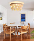 Stylish Boho Fandelier Ceiling Fan With Built In Light And Wireless Remote Six Speeds Low Profile Flush Mount Wood Beaded Detail above dining table.