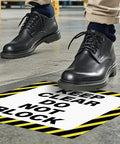 Person walking near a Keep Clear Do Not Block Sign 17 By 17 Inches 5 Pack Self Adhesive Waterproof Vinyl Safety Stickers For Factory Warehouse And Workplace Caution Warning Signage
