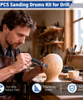 Craftsman using Pro Grade Sanding Drums Kit For Rotary Tool With One Eighth Inch Shank 25 Pcs for wood shaping in workshop