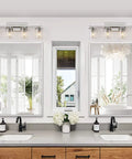 Brushed Nickel Vanity Light Fixtures For Modern Bathrooms With Clear Glass Shades Four Light E26 Standard Socket Sleek Minimalist