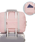 Back view of 30L Foldable Personal Item Duffel Bag 18x14x8 Inches Pink With Shoulder Strap, attached to luggage handle, pocket detail