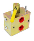 Manual hydraulic valve block with yellow lever, gold metal body and two red ports, front-left view