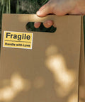 6 Pack Yellow PVC Fragile Shipping Labels with Adhesive Warning Stickers for Moving Boxes and Warehouses, High Visibility Packing Labels for Efficient Shipping and Handling, Bulk Package Stickers on brown box