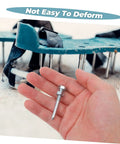 Hand holding metal spike with metal lawn aerator shoes in the background, part of the Metal Lawn Aerator Shoes Spikes 20 Pack Set For Lawn Care Pros.