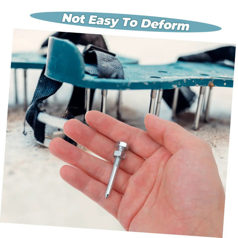 Hand holding metal spike with metal lawn aerator shoes in the background, part of the Metal Lawn Aerator Shoes Spikes 20 Pack Set For Lawn Care Pros.