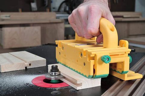 GRR RIPPER GR 100 3D Adjustable Table Saw Pushblock 2 Pack used on table saw for precise wood cutting in bright yellow