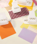 All In One Border Punch Embossing Tool for Scrapbooking with various edge designs on colorful papers