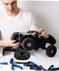 Person assembling RC car with Track Wheel Replacement Kit For Toy Tank Crawler All Terrain Off Road DIY Drive System Upgrade