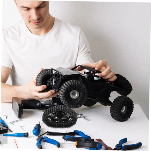 Person assembling RC car with Track Wheel Replacement Kit For Toy Tank Crawler All Terrain Off Road DIY Drive System Upgrade
