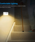 Six Pack Mini Motion Sensor Stair Lights Battery Powered Night Lights illuminating indoor stairway at night
