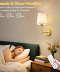 Gold Cordless Wall Sconces Set Of Two Battery Operated Rechargeable Dimmable Led Lamps With Fabric Shades Totally Wireless Home Lighting beside a bed with a woman sleeping.