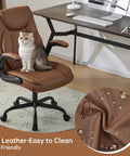 Leather Home Office Desk Chair With Ergonomic Back Support, Swivel Wheels, Flip Up Armrests shown with cat sitting, brown.