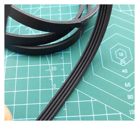 PJ307 Drive Belt For Conveyor Systems High Elasticity Timing Belt With Safety Shield Reduces Vibration, Delivers Smooth, Quiet Operation And Rock Solid Positioning For Reliable Transport. Black 4-rib conveyor timing belt on cutting mat